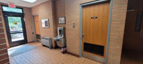 Restrooms located in hallway.